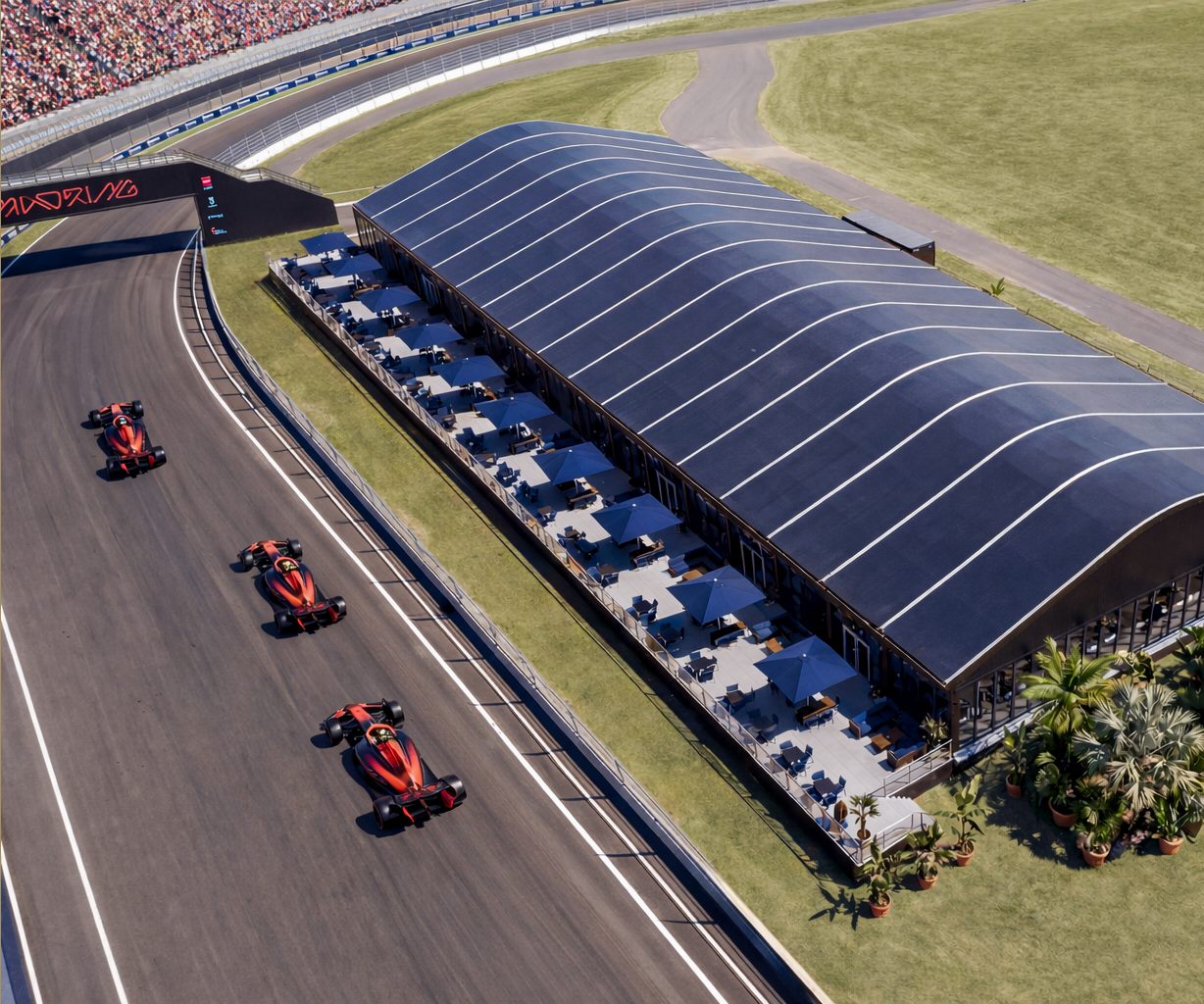 Ignition Club &mdash; vista a&eacute;rea do pavilh&atilde;o &agrave; beira da pista com carros passando